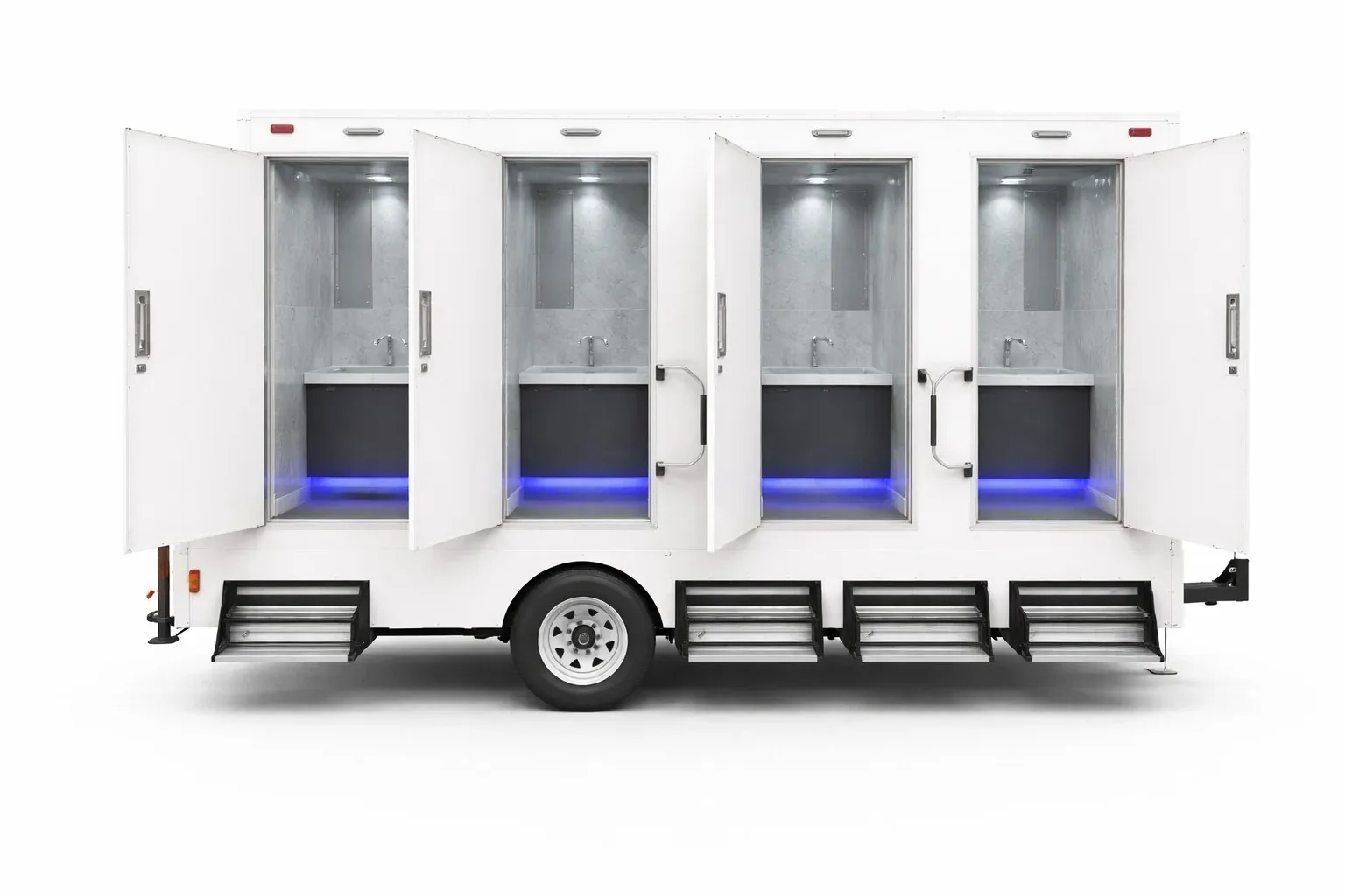 White 4-stall restroom trailer with all four doors open, each restroom showing a vanity and sink with blue floor lighting, and folding steps below every door